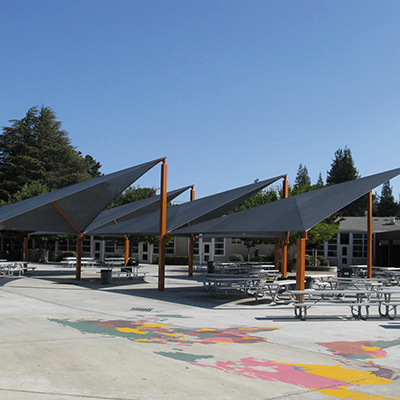 Shade structures like canopies, in public environments, providing shade and UV protection.